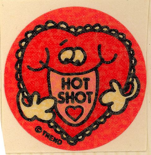 A sticker showing a smiling heart saying 