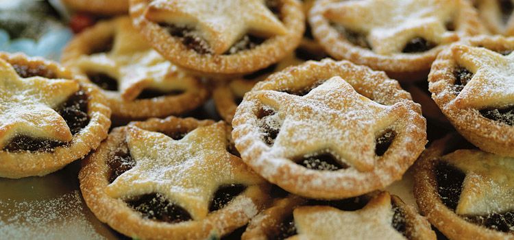 Little mince pies covered with powdered sugar.