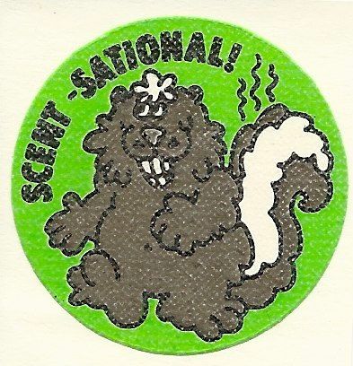A sticker showing a skunk and stating Scent-sational!