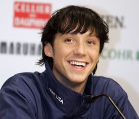 close-up of Johnny Weir in a warm-up jacket at a press conference