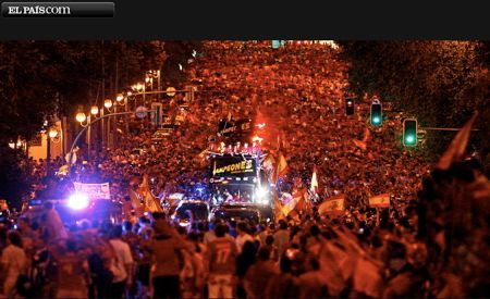 victory throng at night in the streets of Madrid