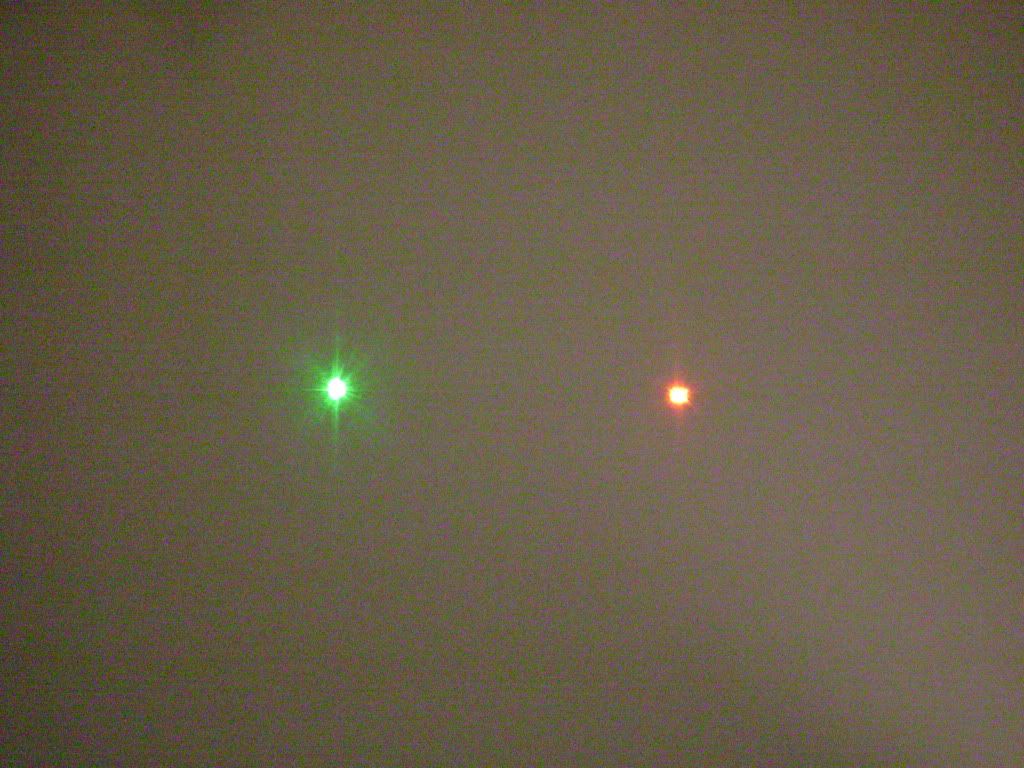 Green Laser vs. RedLaser in a darkened room