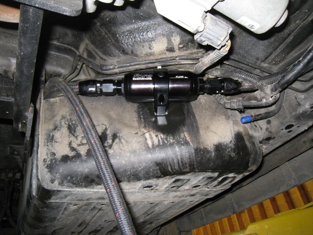 ... to the filter mount point. i was able to place it in such a way to drill and run a small bolt with locking nut to hold it to the tank shell